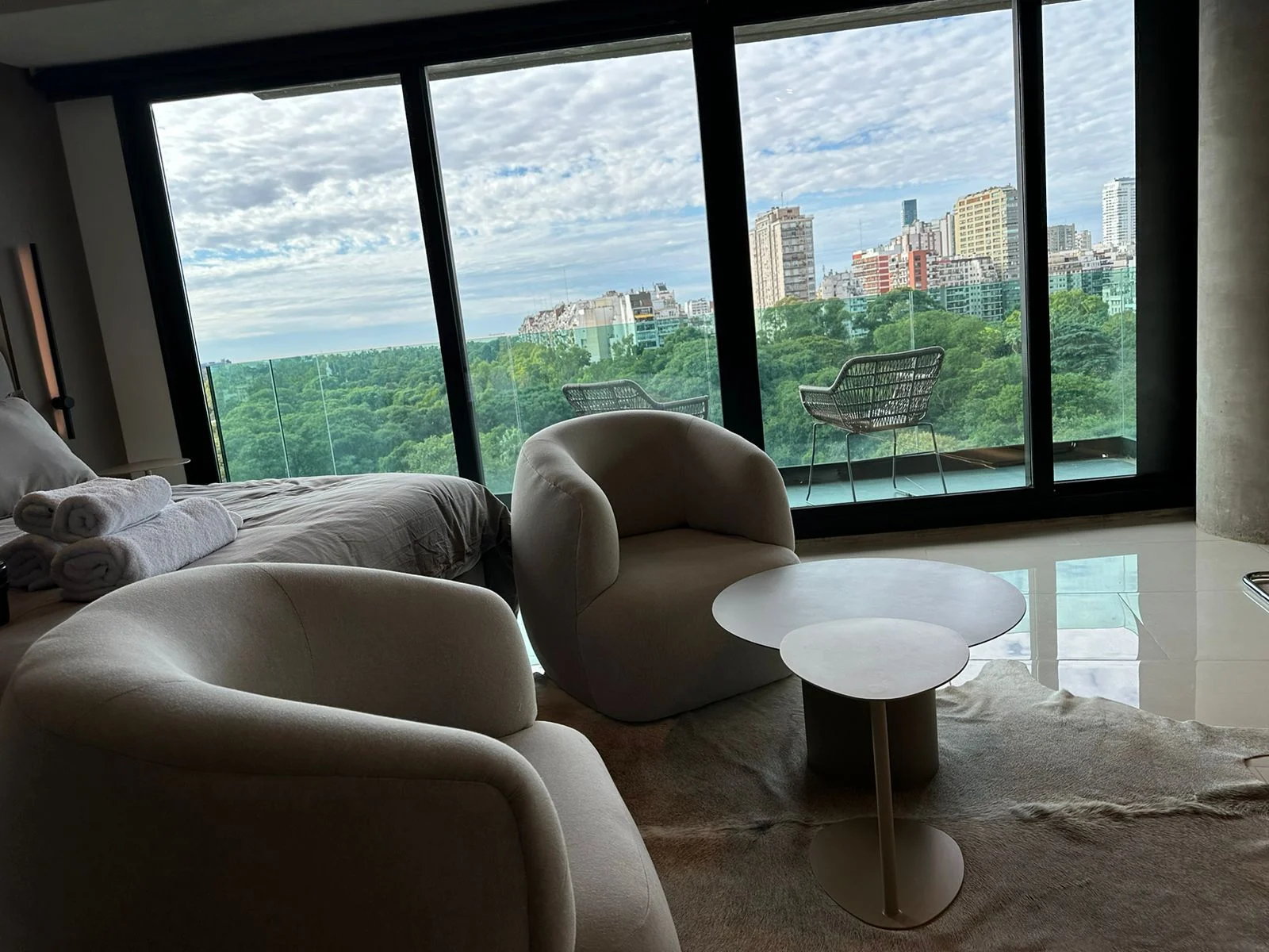 Luxury living area and large windows overlooking the treetops